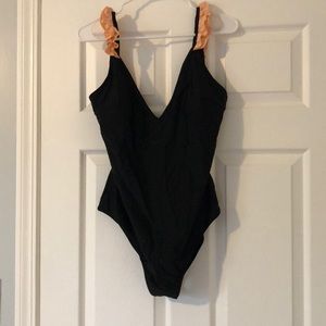 Women’s one piece swimsuit.